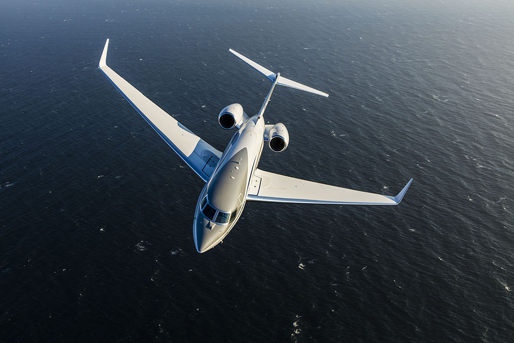 Gulfstream G650ER over water.